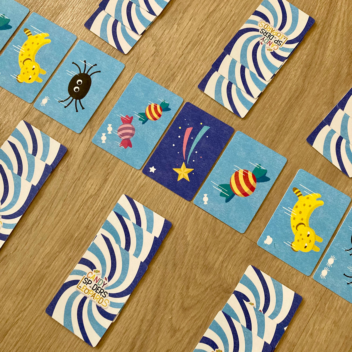 Candy Spiders Leopards programming cards laid out before a trick