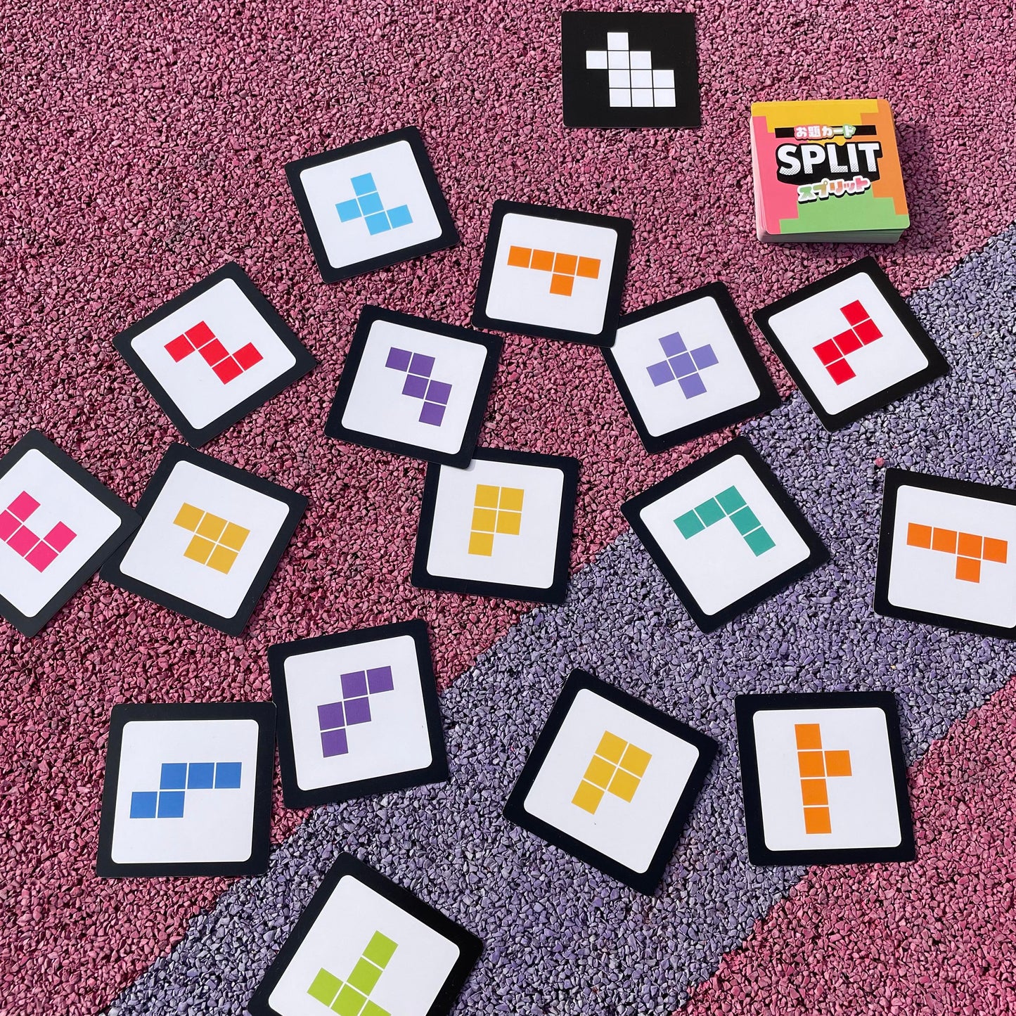 Close-up of SPLIT puzzle cards forming a matching shape