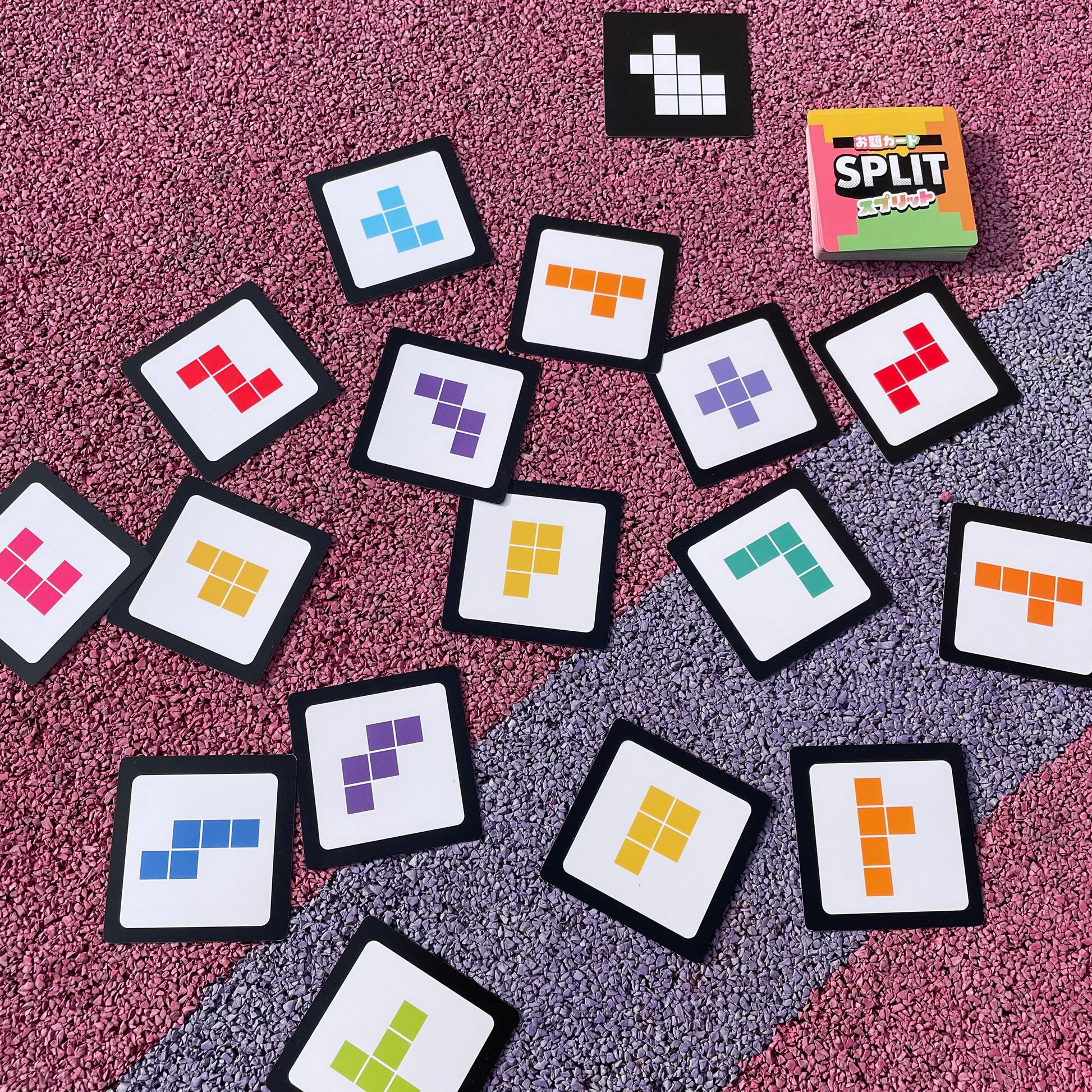 Close-up of SPLIT puzzle cards forming a matching shape