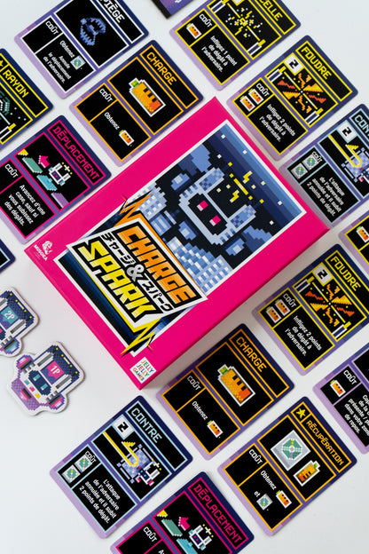 Charge & Spark two-player game set up on a table